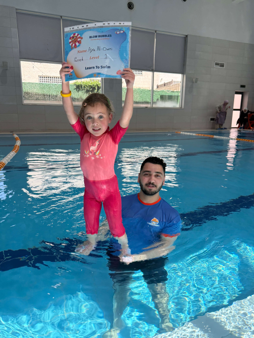 Junior swimmers stroke practice lane